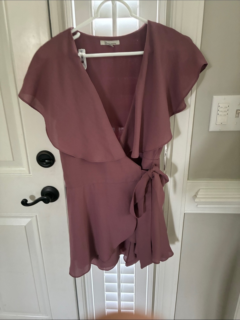 the clothing company Mauve Ruffle Tie-Front Romper